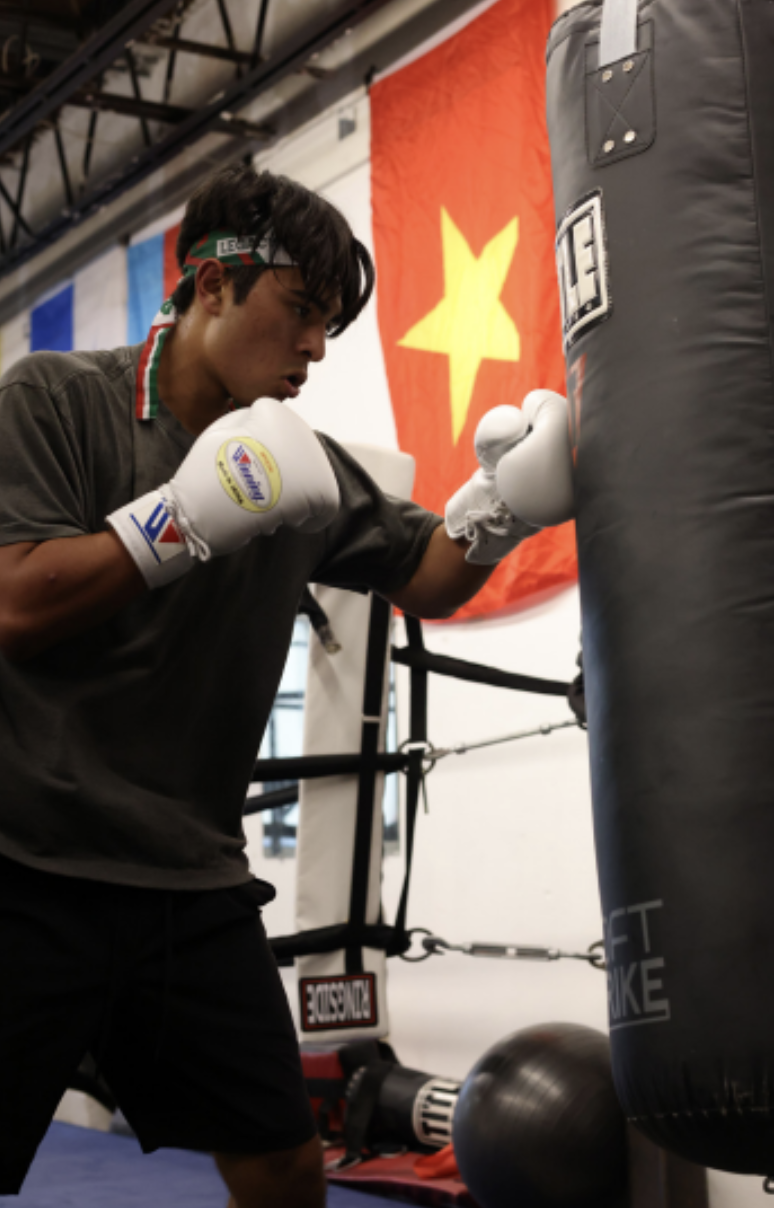 Gabe Ponce (12) and his father Jose Ponce begin their training in the ring on the focus-mitt. His father has trained countless professional fighters in St. Louis. “Gabriel is surrounded by that type of environment where he sees what that top level looks like,” Jose Ponce said.